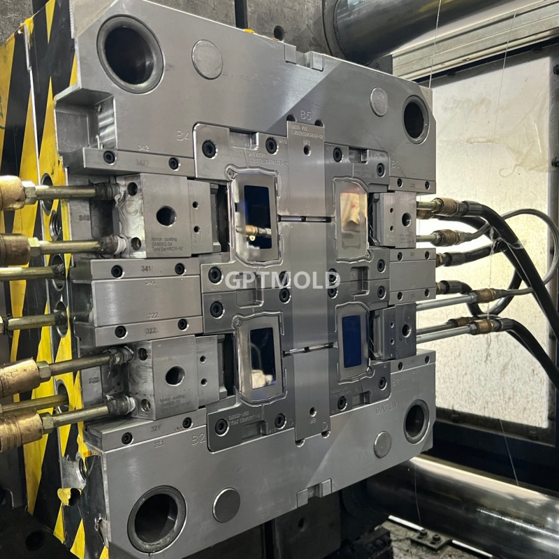 Optical injection mold mounted in a molding machine