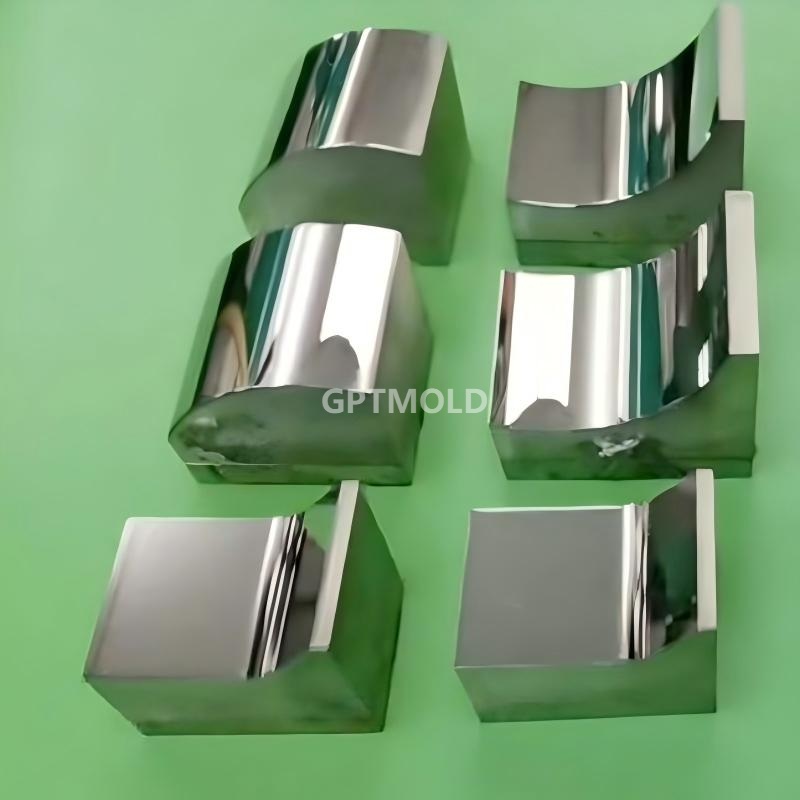 Six metal inserts with curved and flat reflective surfaces