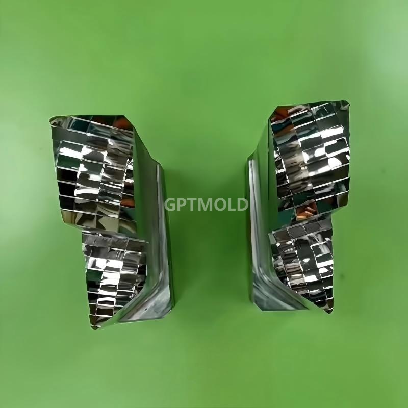 Two machined reflective inserts with repeated faceted surfaces